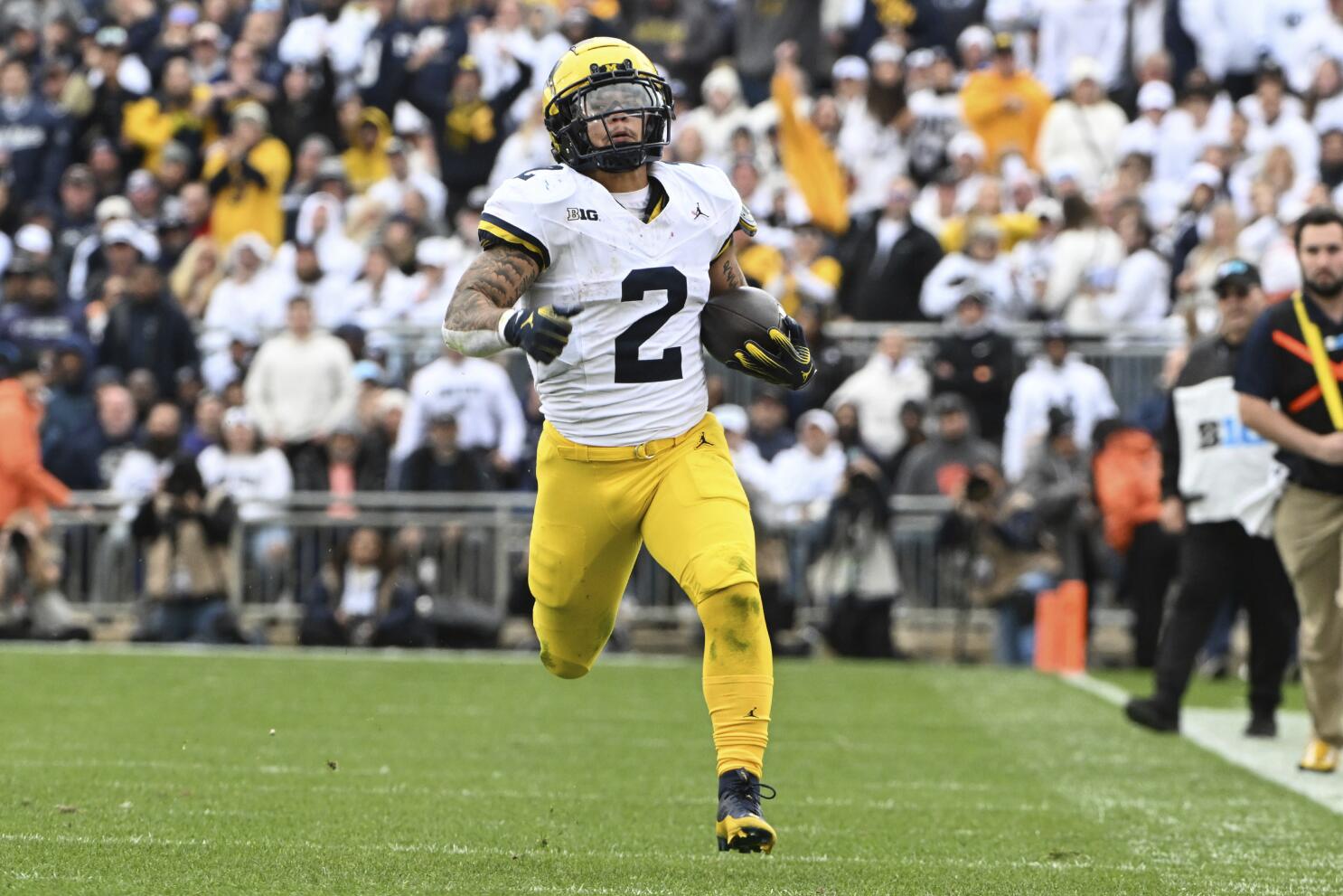 Without Jim Harbaugh No. 2 Michigan grinds past No. 9 Penn State